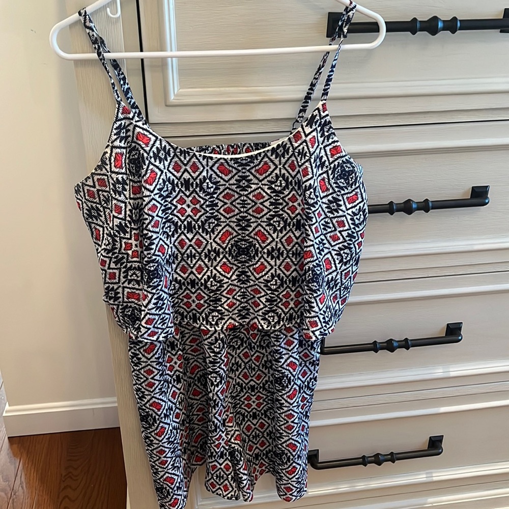 Size large romper. Navy Blue, red & white pattern. Worn twice.